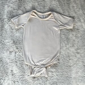 Kate Quinn Cream Onesie